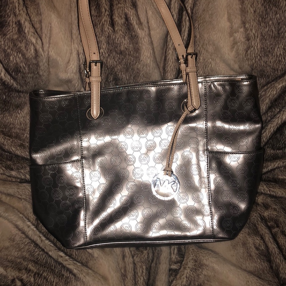 Micheal Kors platinum satchel.